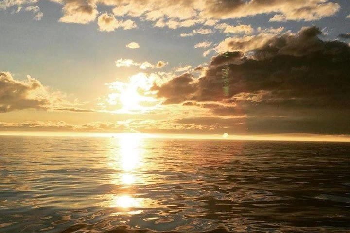 a sunset over a body of water