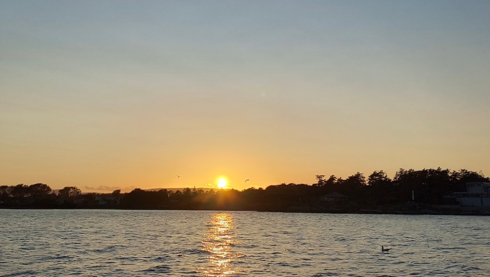 a sunset over a body of water