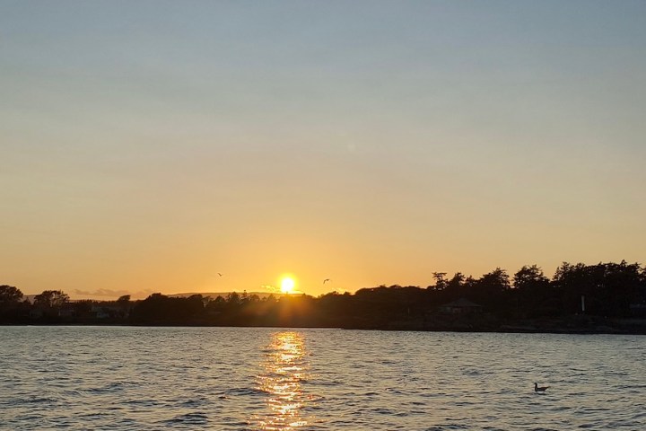 a sunset over a body of water